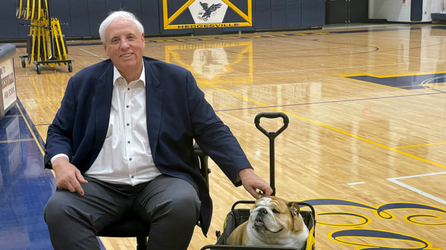 jim-justice-and-babydog-on-the-court-1.png