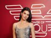 Kendall Jenner stupisce con uno scintillante abito argento mentre festeggia alla festa Energy Of You durante la settimana della moda di Milano