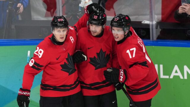 Canadas-Sam-Reinhart-13-celebrates-with-Nathan-MacKinnon-29-and-Macklin-Celebrini-17.jpg