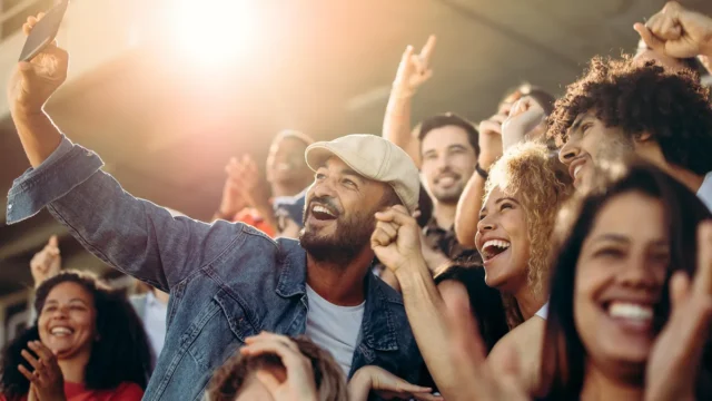 group-of-supporters-taking-selfie-watching-a-football-match-jacob-lund-adobe-stock-jacob-lund-adobe.webp