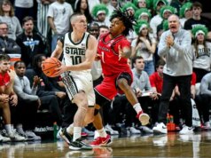 Il numero 8 dello Stato del Michigan tiene a bada Rutgers per aggiudicarsi il triplo addio dei Huge Ten