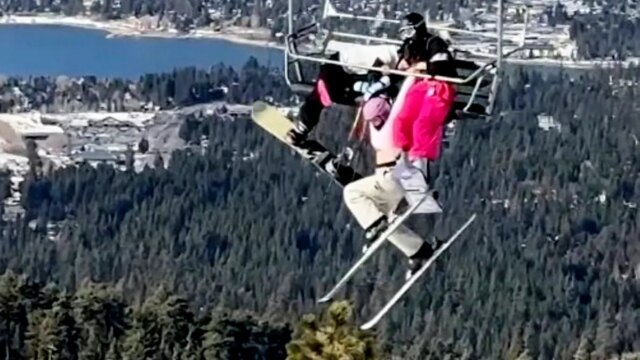skier-holding-chairlift-dangling-california.jpg